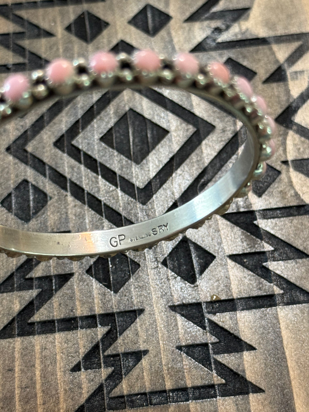 Native pink conch bangle stamped GP & SRY