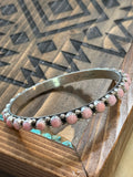 Native pink conch bangle stamped GP & SRY