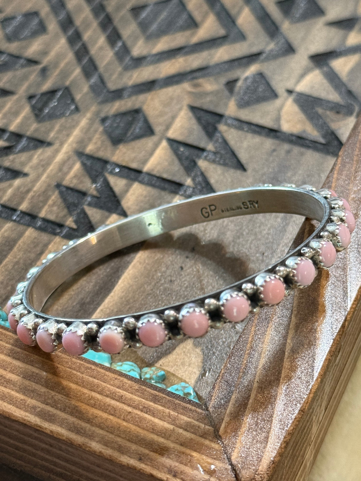 Native pink conch bangle stamped GP & SRY