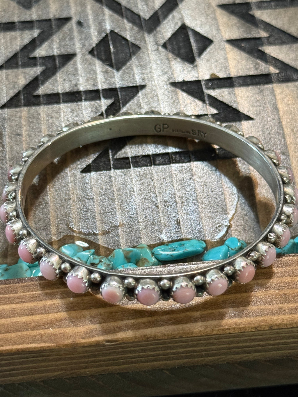 Native pink conch bangle stamped GP & SRY