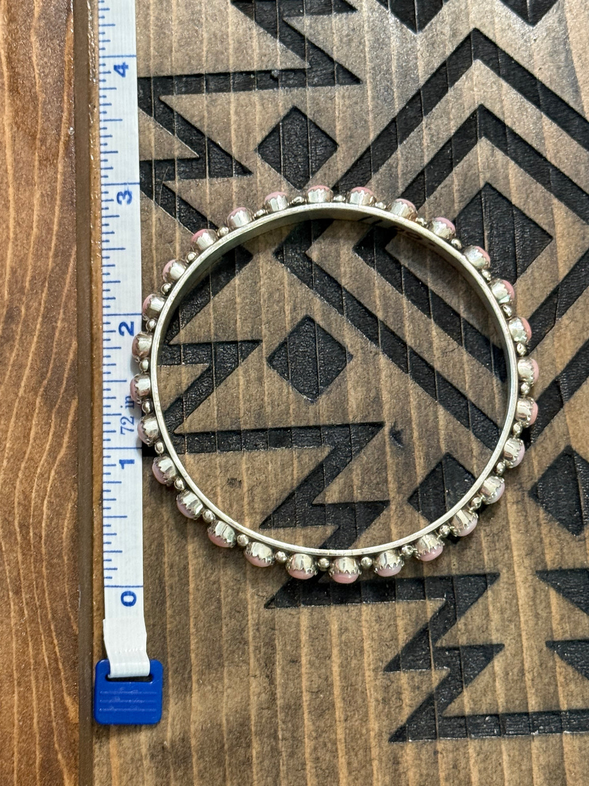 Native pink conch bangle stamped GP & SRY
