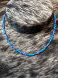Hand strung blue & purple seed bread necklace 16”