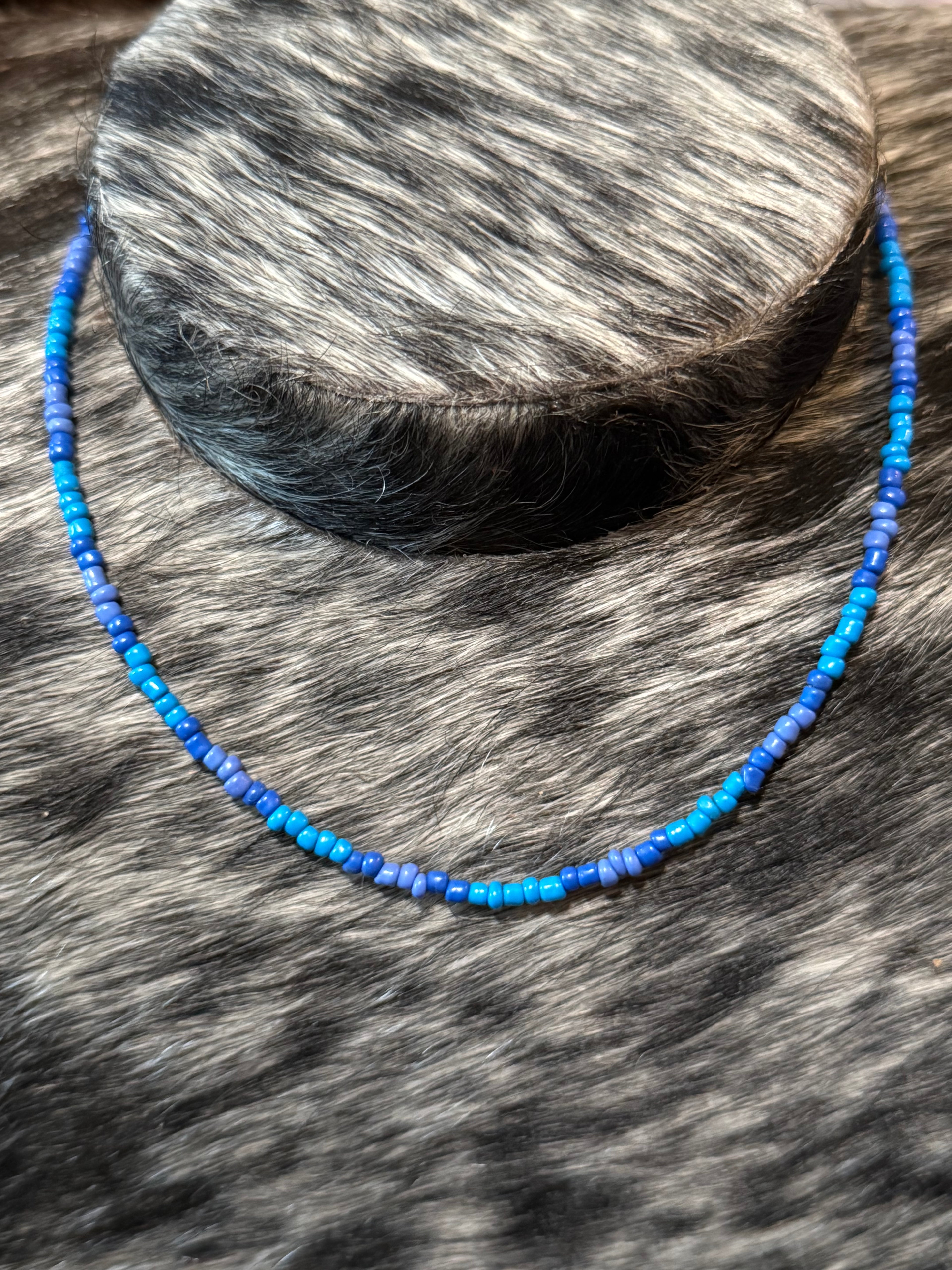 Hand strung blue & purple seed bread necklace 16”
